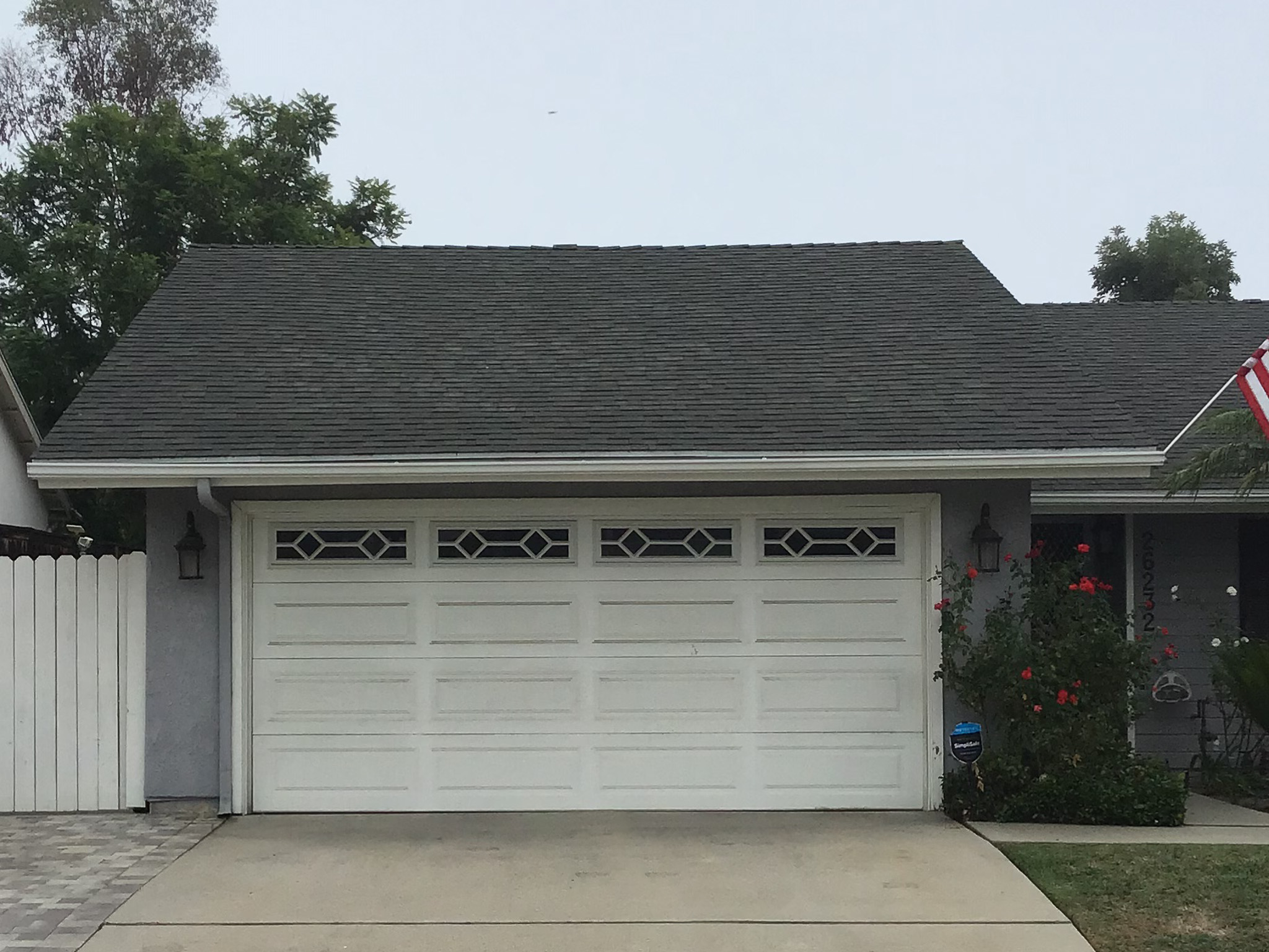 before retrofit faded yelowed standard white garage door