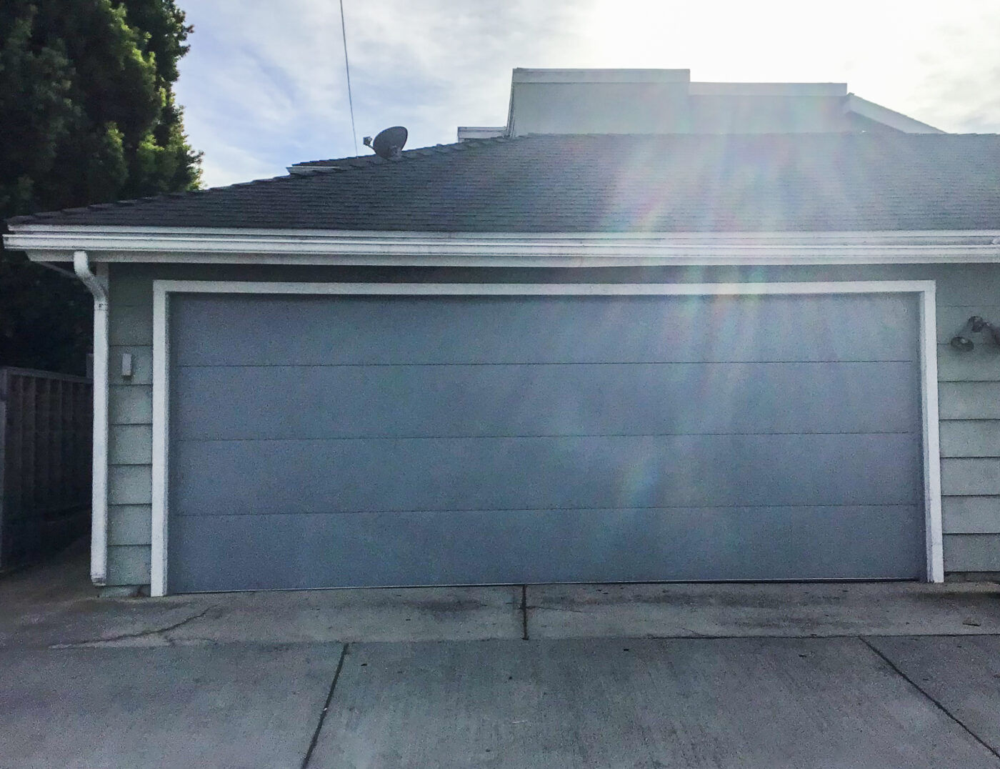 gray modern garage door in costa mesa after installation