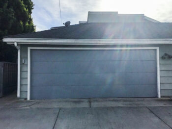 gray modern garage door in costa mesa after installation