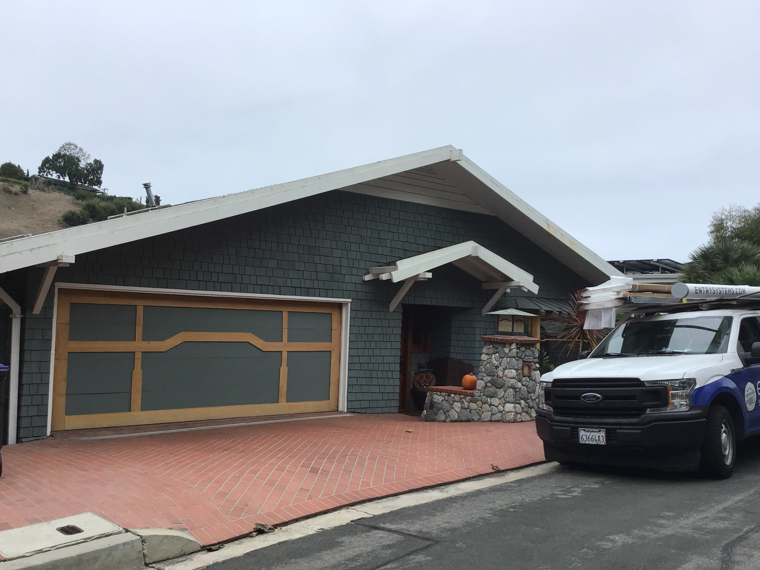 one piece blue garage door before upgrade