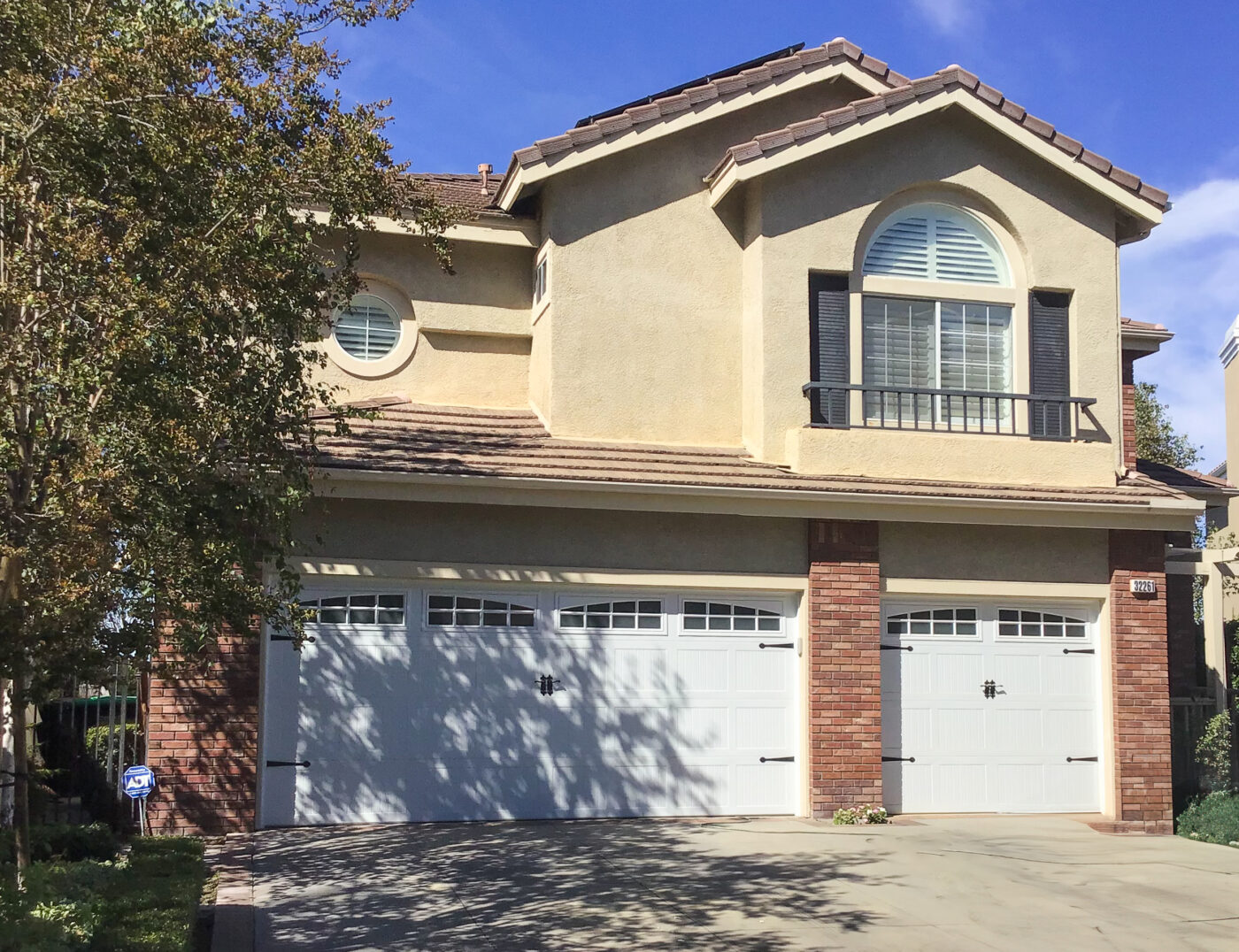 white carriage house garage door with windows