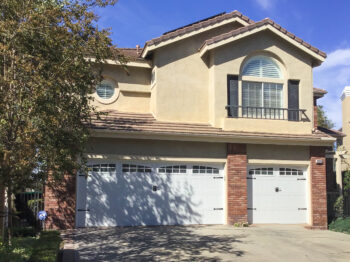 white carriage house garage door with windows