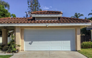 white traditional white raised panel garage door