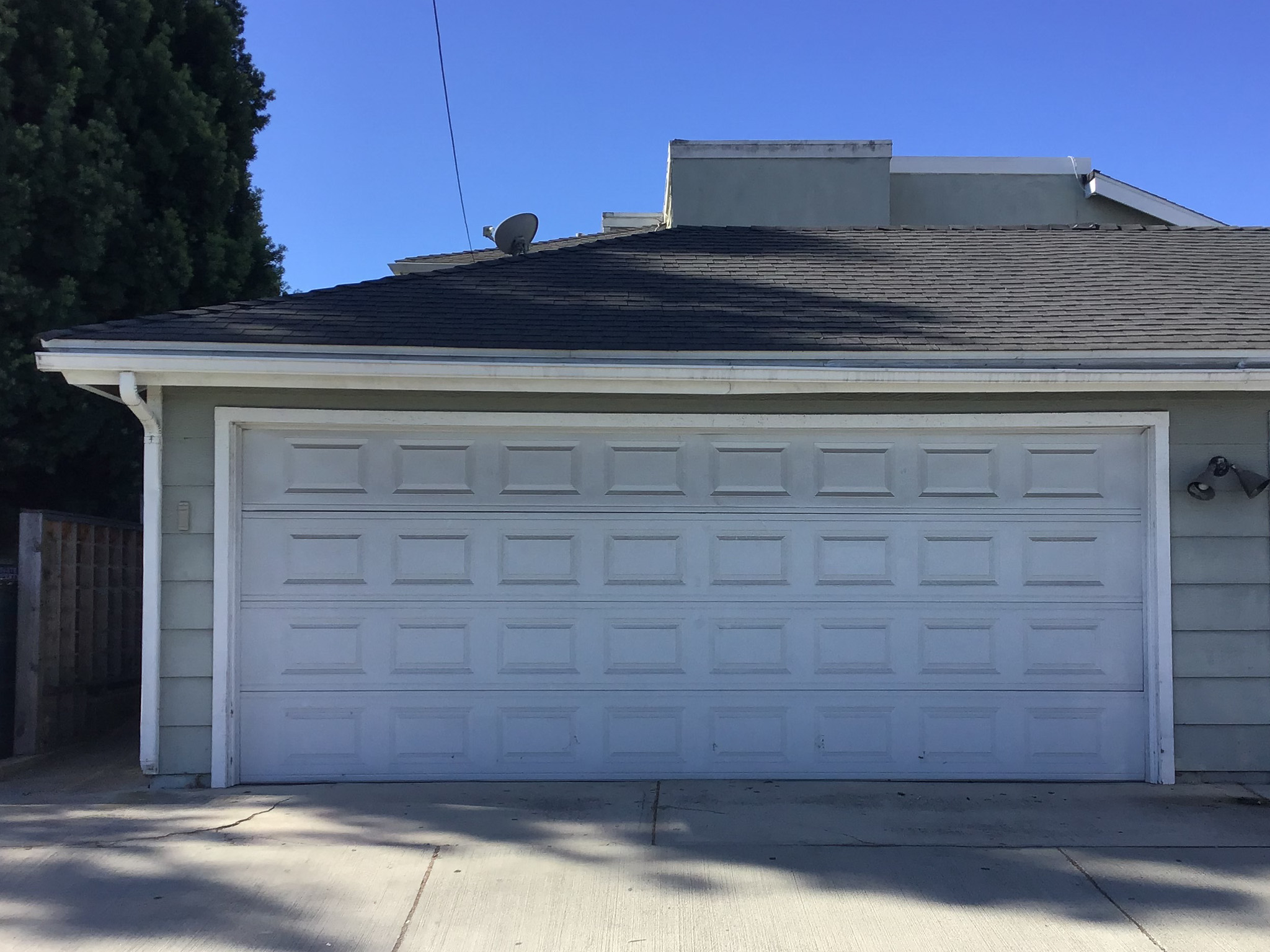 short panel white garage door in Costa Mesa before replacement