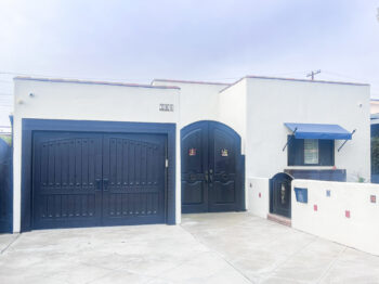 alder custom wood garage door in san clemente spanish style