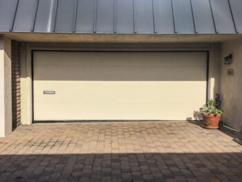 modern almond flush garage door upgrade in dana point