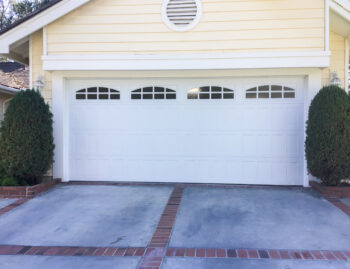 white traditional shaker design garage door with windows upgrade in Laguna Niguel