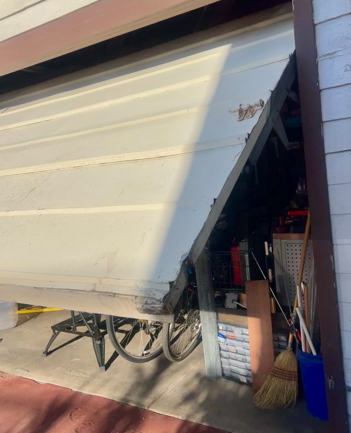 one piece half open garage door that is aging
