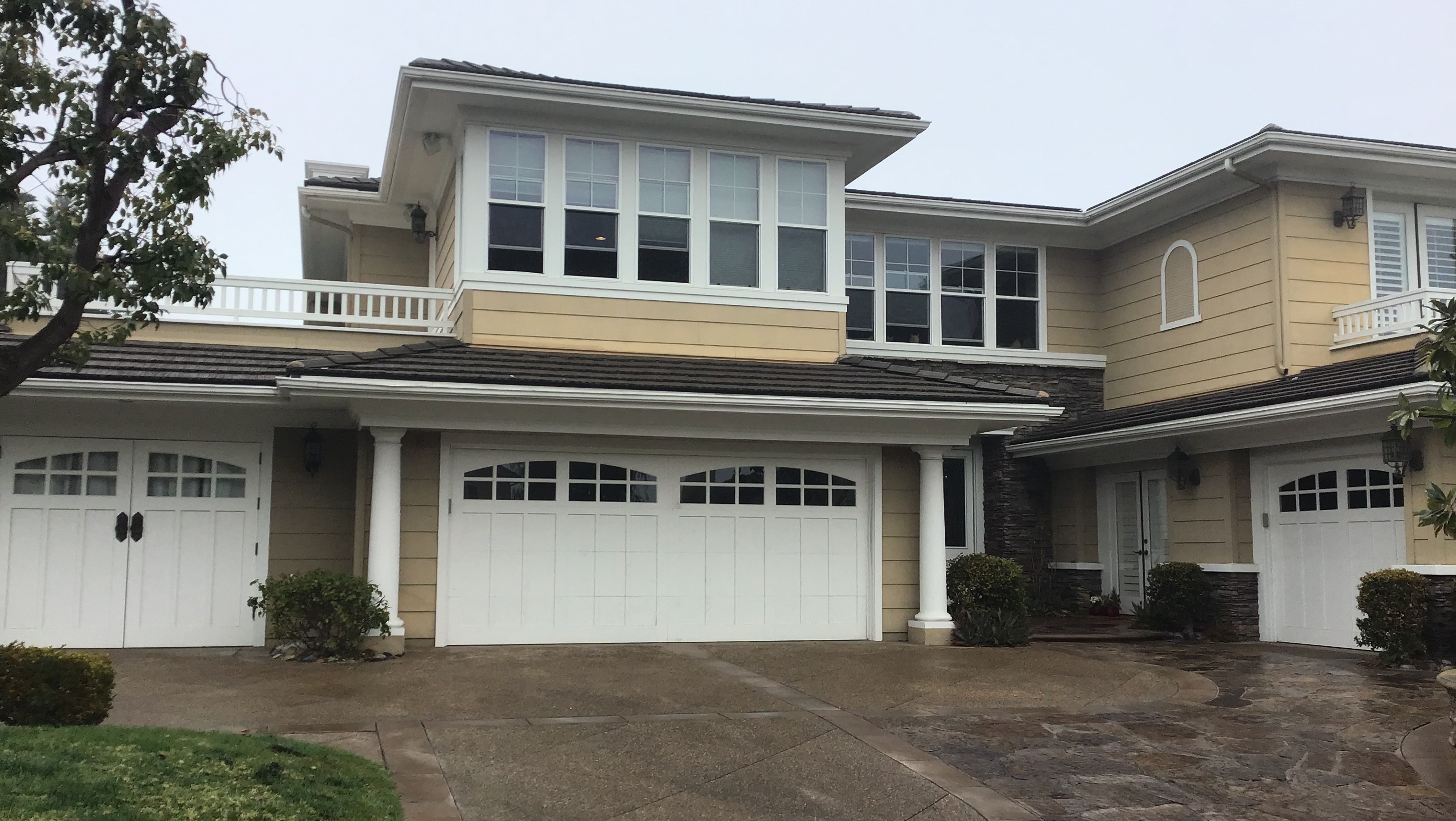damaged wood garage door in dana point