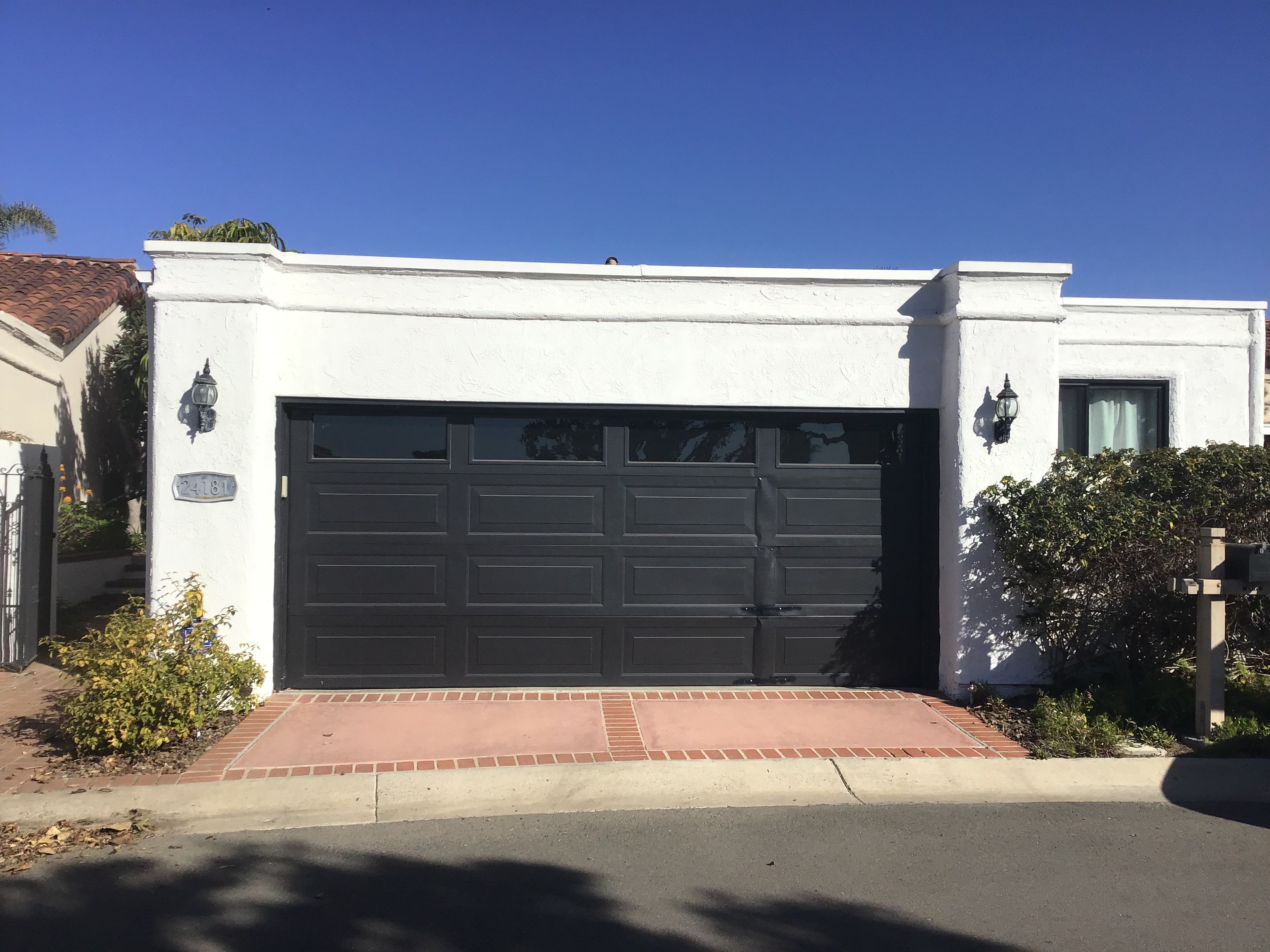 traditional black garage door in dana point