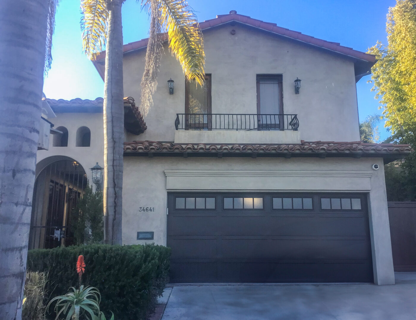 brown steel garage door after install with madison windows