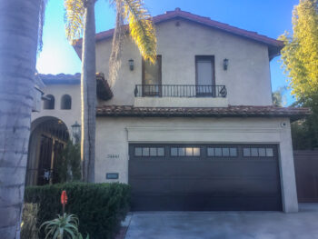 brown steel garage door after install with madison windows
