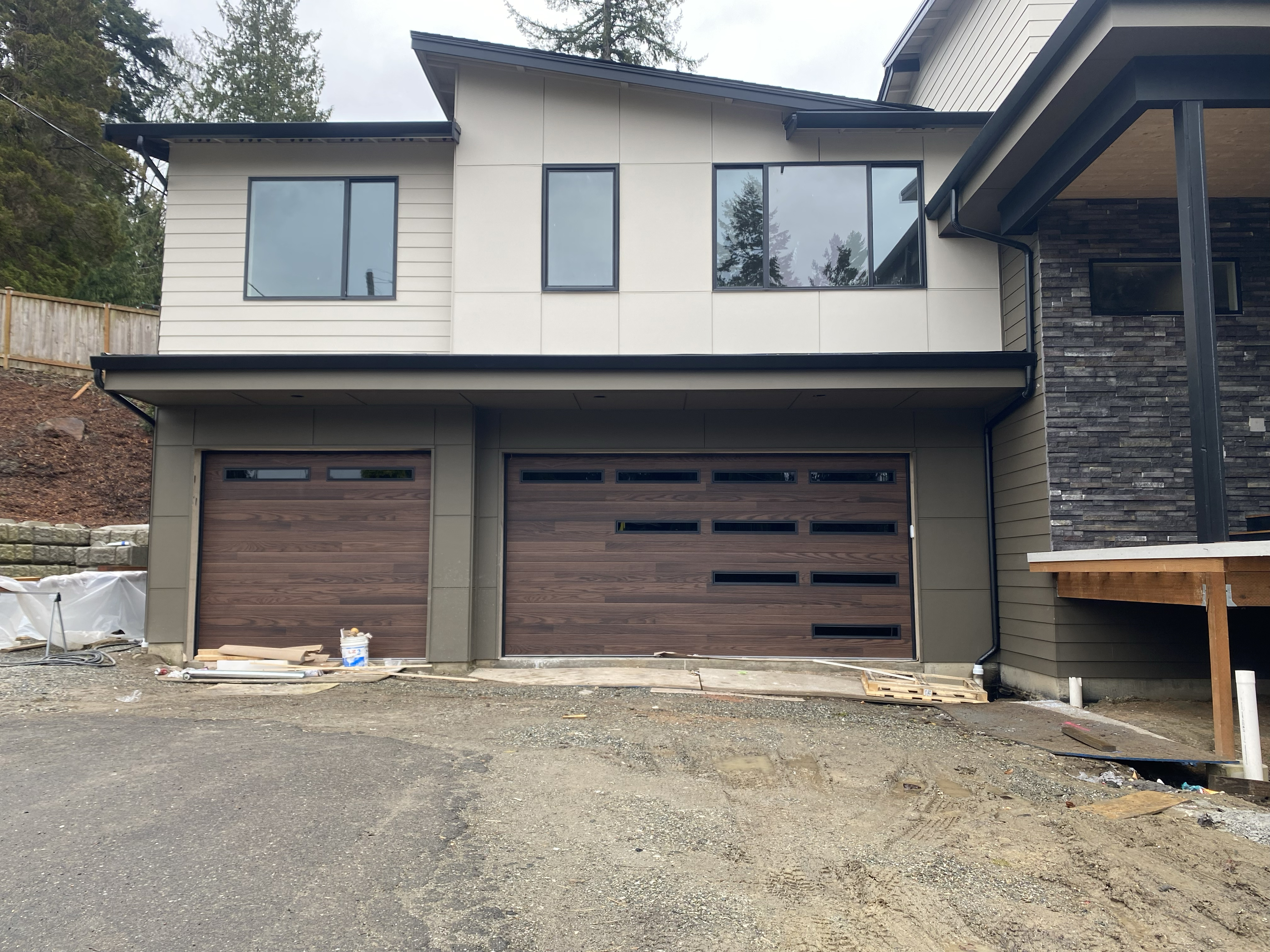 dark oak faux wood garage door with modern windows
