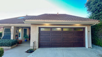 mahogany faux wood garage door with windows