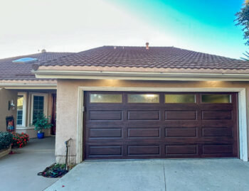 mahogany faux wood garage door with windows